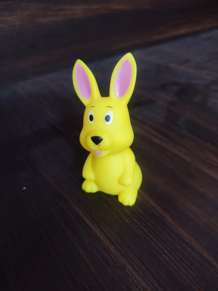 Yellow rabbit toy with pink ears